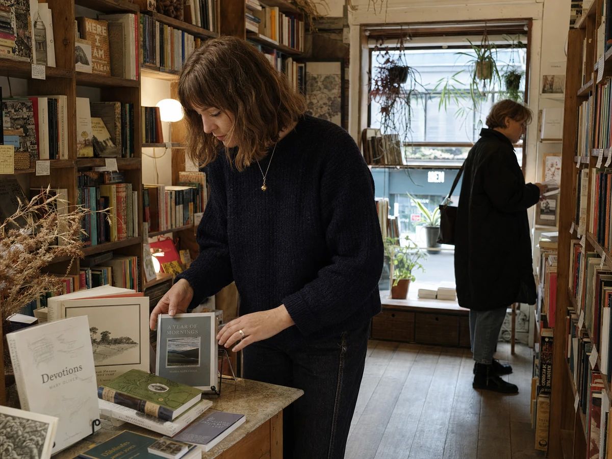 Boutique owner choosing a custom music identity for the shop